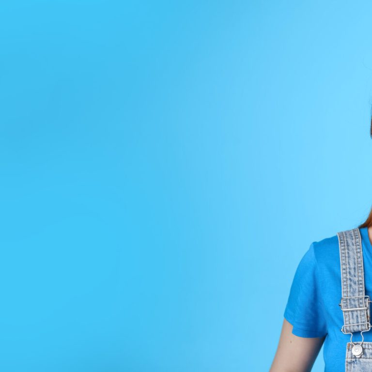 Dreamy creative cheerful redhead woman contemplate sky, smiling upbeat, rejoice good summer weather, gaze up happy, grin satisfied, observe interesting promo, stand blue background.